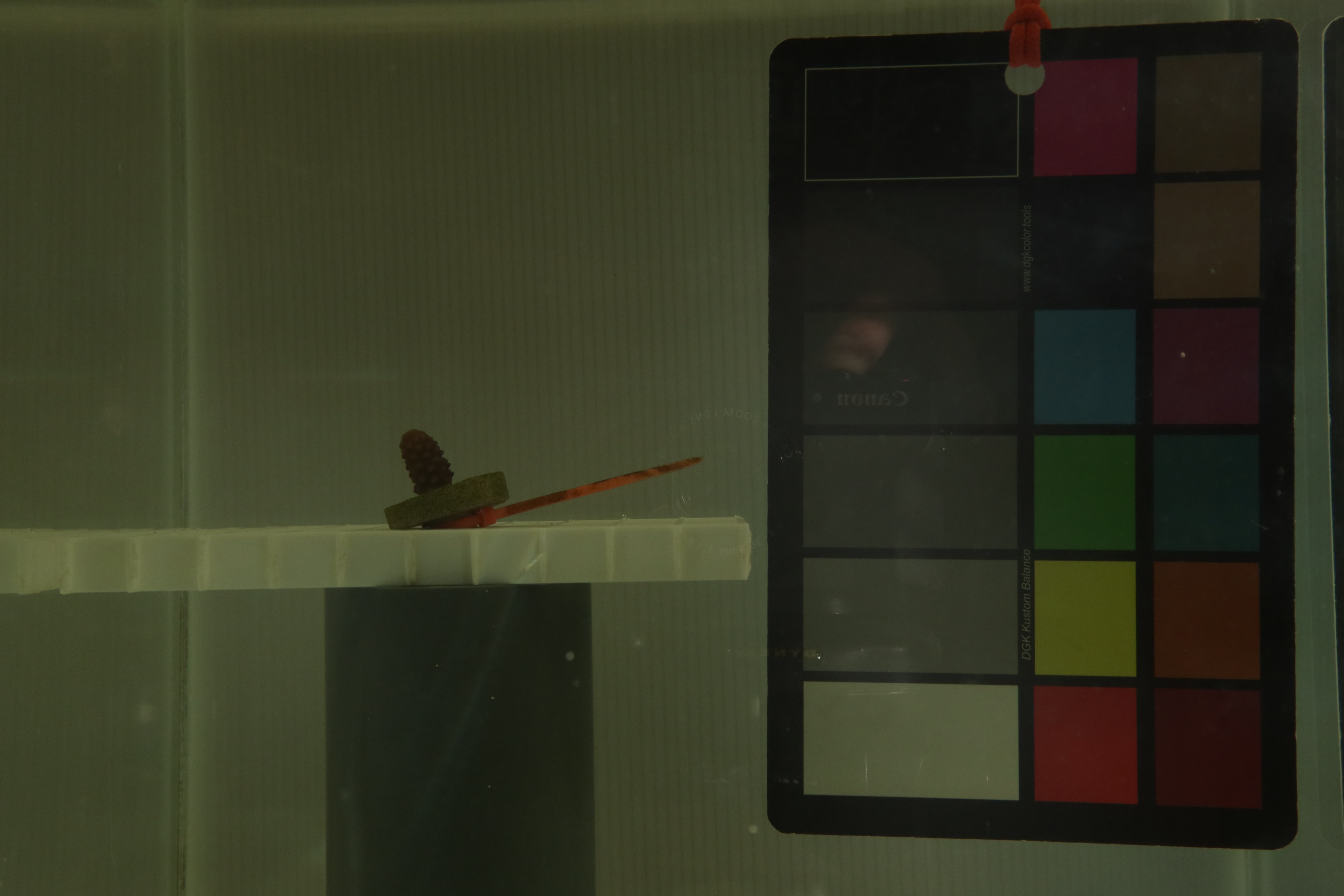 Figure 6: Hand reflection is still noticeable due to ambient light, even with the backdrop.